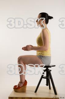 Sitting reference of whole body yellow t shirt gray shorts…